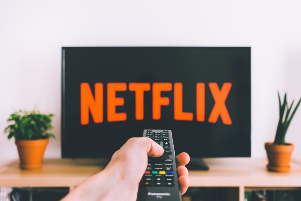 Remote pointing at Netflix on television